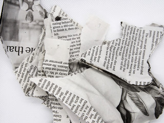 torn and crumpled newspaper