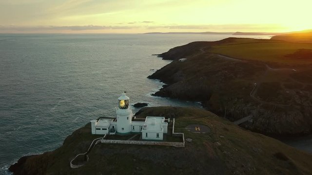 Aerial view of Strumble Head lighthouse on the Pembrokeshire Coast, Wales, UK