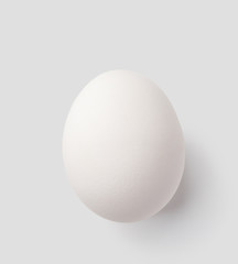 white egg isolated on gray with clipping path