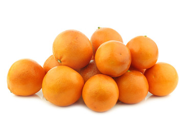 bunch of fresh blood oranges on a white background