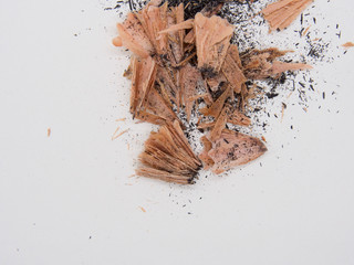 Debris from pencil sharpening on white background 