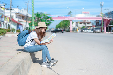 A woman is looking at a map for traveling,traveling in Thailand,traveling in Chiang mai 