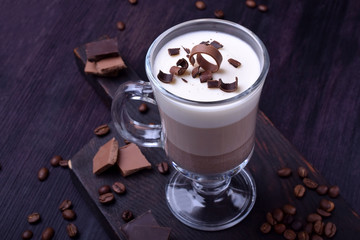 Layered dessert in an Irish glass mug with coffee and chocolate