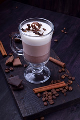 Layered dessert in an Irish glass mug with coffee and chocolate