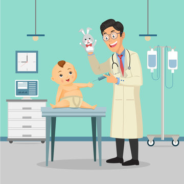 Doctor pediatrician performs a vaccination of a baby boy in hospital. The doctor is holding a toy.