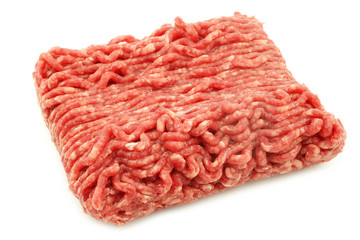Raw minced beef meat on a white background
