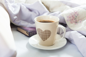 Bedroom on the bed, morning coffee. Happiness. A heart.