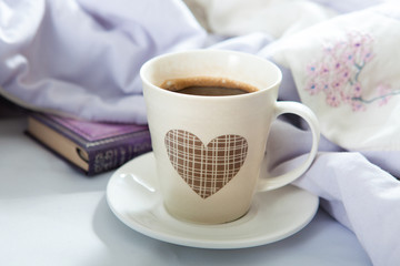Bedroom on the bed, morning coffee. Happiness. A heart.