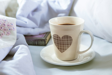 Bedroom on the bed, morning coffee. Happiness. A heart.