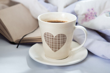 Bedroom on the bed, morning coffee. Happiness. A heart.