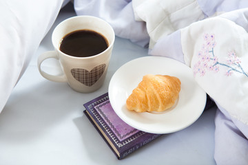 Bedroom on the bed, morning coffee. Happiness. A heart.