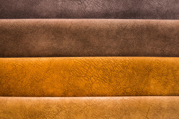 Colorful and bright fabric samples of furniture and clothing upholstery. Close-up of a palette of textile abstract stripes of different colors