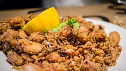 Plate of chopitos, plate of small calamari fried with lemon