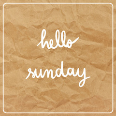 Hello Sunday on brown crumpled paper background