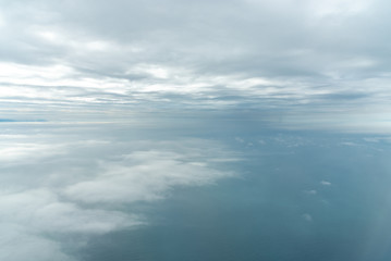 Naklejka na ściany i meble Blue sky background, viewed from an airplane window.