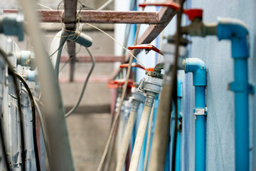 Washing machine business behind the washing machine connected to the water delivery system.