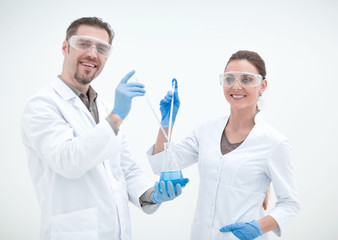 two cheerful scientists biologist on a light background