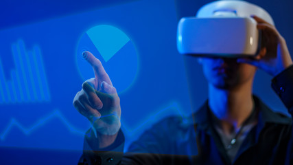 Young guy in a black shirt and white glasses of virtual reality