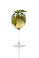 Sparkly fresh holiday cocktail drink with basil and ice