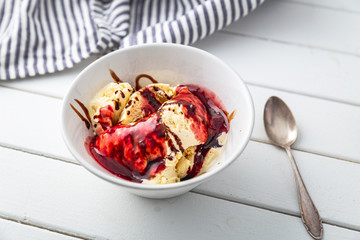 delicious vanilla ice cream with raspberry sauce