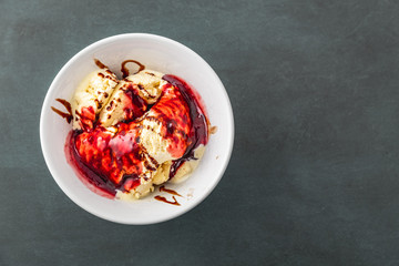 delicious vanilla ice cream with raspberry sauce