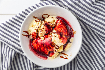 delicious vanilla ice cream with raspberry sauce