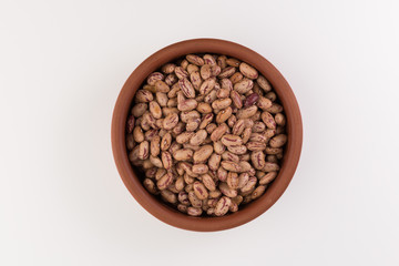 A plate of beans on white background