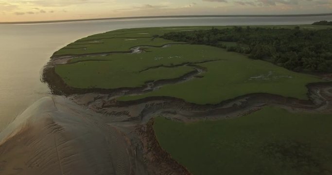 Aerial slow move forward of Marajo Island Amazon River inlets and tributaries carved out in the mud landscape at low tide