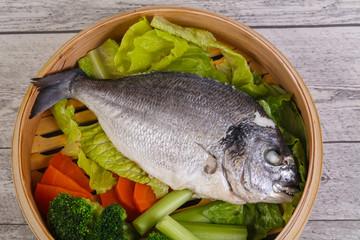 Steamed dorada with vegetables