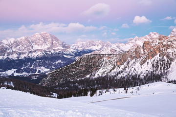 Fototapeta na wymiar Cortina Ampezzo ski resort mountains covered in snow at suns
