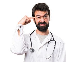 Young doctor making crazy gesture on white background