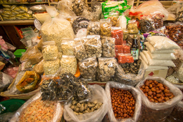 shelves and sacks with various food products in a super market in Thailandlves ,Supermarket with bokeh,customer defocus ,vintage color
