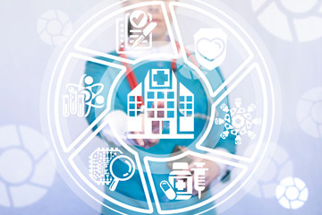 Obraz premium Beautiful female doctor working on a virtual screen of the future and touching the icon: hospital. Medical modern clinic health care concept.