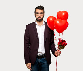 Man in valentine day with sad and depressed expression over isolated grey background