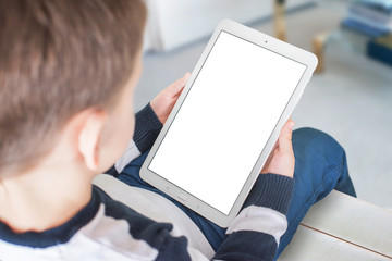 Boy holding tablet with blank screen for app, web site presentation.