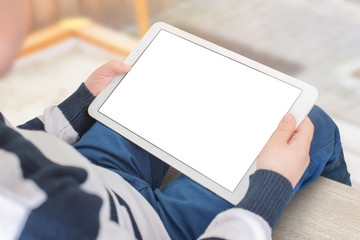 Tablet mockup in boy hands, horizontal position. Close up scene. Isolated screen for app, game, movie presentation.