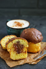 Brioche bun with chocolate filling and chocolate coating.