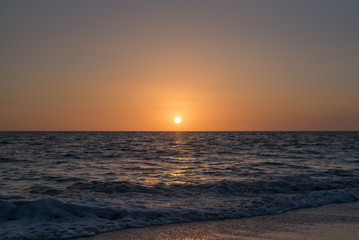 Calm dim sunset over ocean