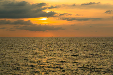 Silhouette of a boat at sunset