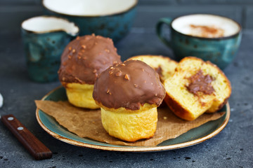 Brioche bun with chocolate filling and chocolate coating.