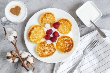 White Cup of Coffee Cappuccino with Heart Pattern of Cinnamon, Cottage Cheese Pancakes with Raspberries, Healthy Breakfast, Traditional Food, Valentines Day