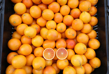 many red Sicilian oranges in a greengrocer