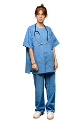 A full-length shot of a Young redhead nurse is a little bit nervous and scared pressing the teeth over isolated white background