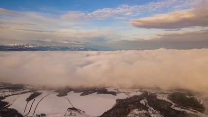 Sunset in the winter mountains landscape. Aerial view from above.