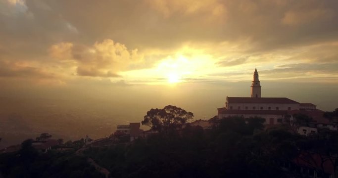 Sunset aerial of mountain-top Monserrate Church in Bogota Colombia