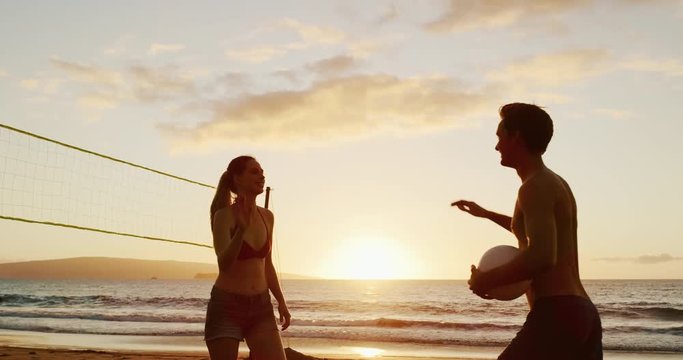 Fiends high five playing beach volleyball at sunset, slow motion cinematic summer lifestyle