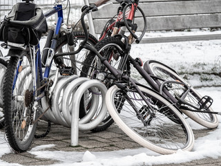 Bikes left in parking slots during winter days, waiting for better time