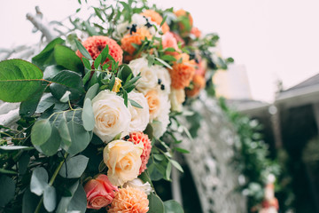Square wedding ceremony. Transparent chairs are decorated with flowers, greenery. Cute, trendy...