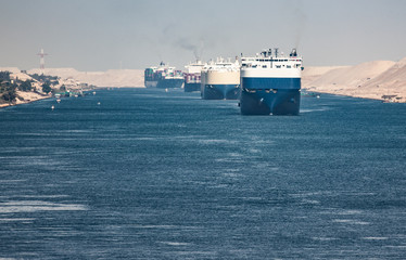 The Suez Canal is a shipping canal in Egypt.A cargo ship drives the Suez Canal.