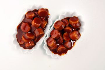 currywurst. traditional german food with sausages and curry